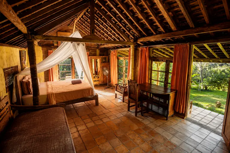 King-size bed in the 1-Bedroom Villa at Oemah Tepi Sawah