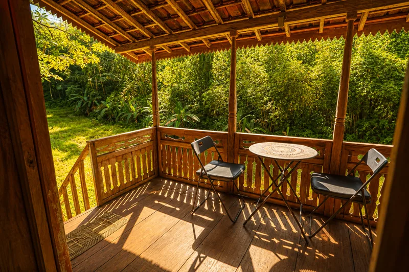 Table and chairs on the terrace of the Double Room Garden View