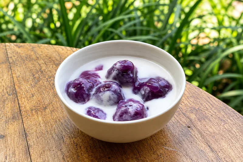 Purple sweet potato balls served with coconut milk