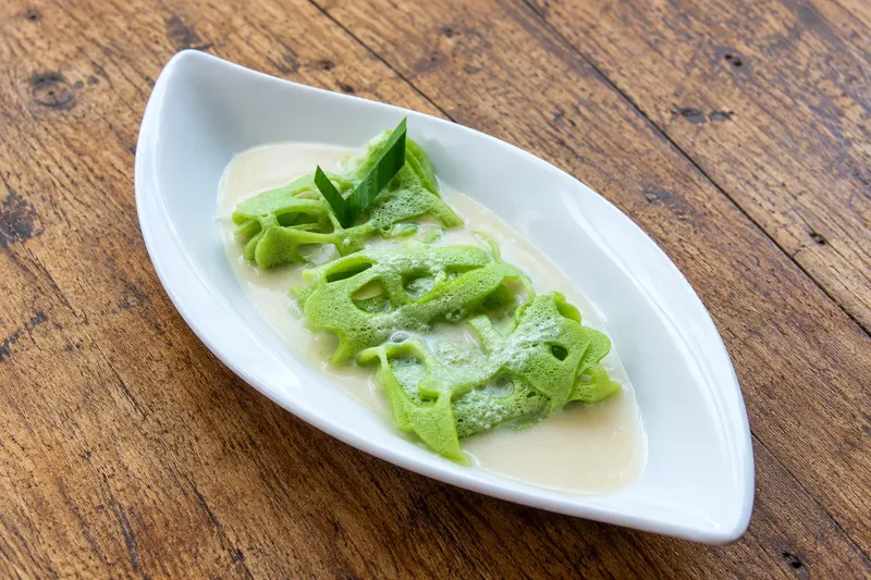 Roti Jala pandan net crepes with coconut milk and palm sugar sauce at Oemah Tepi Sawah
