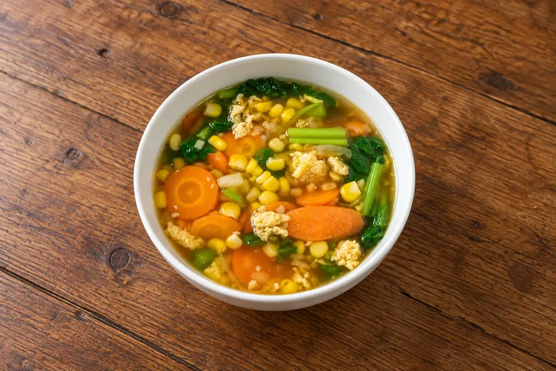 Sup Jagung Indonesian corn soup with egg, carrots and vegetables